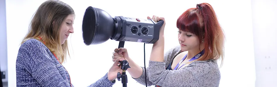 students altering lighting